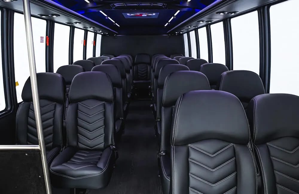 Executive charter coach with forward-facing seats