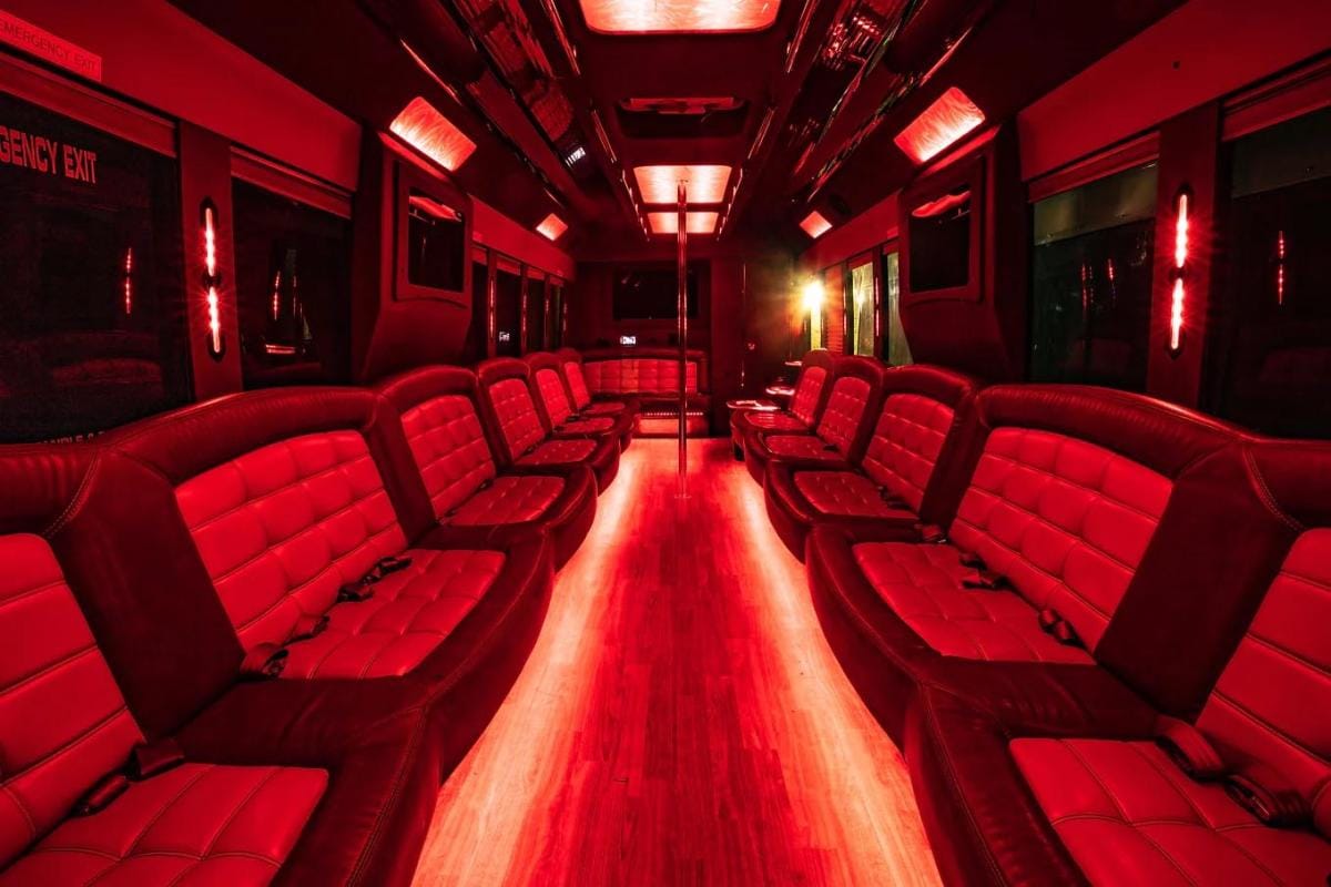 50-passenger party bus interior with red leather seating